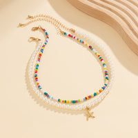 Thumbnail for Boho Layered Seed Bead Starfish Pendant Pearl Chain Necklace Set - ArtGalleryZen