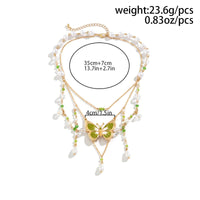 Thumbnail for Chic Layered Floral Pearl Chain Tassel Butterfly Necklace - ArtGalleryZen