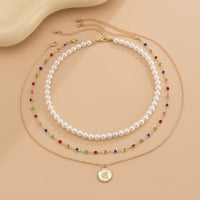 Thumbnail for Chic Layered Relief Round Disk Pendant Crystal Pearl Chain Necklace Set - ArtGalleryZen