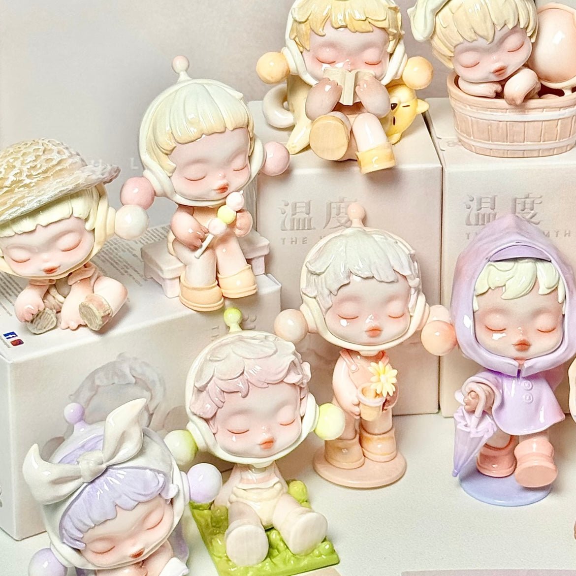 Collection of pastel-colored Pop Mart Skullpanda figurines on a white background