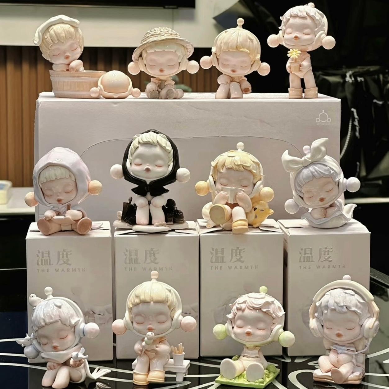 Collection of Pop Mart Skullpanda small figurines on boxes with a blurred background