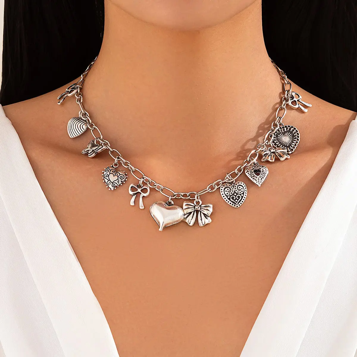 Elegant Gold Silver Tone Relief Heart Bowknot Tassel Necklace - ArtGalleryZen