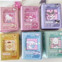 A collection of Sanrio themed 3 inch mini photocard albums featuring various characters such as Hello Kitty and My Melody. The albums come in different colors and designs, some with character portraits and others with character-themed backgrounds.