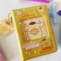 A collection of Sanrio themed 3 inch mini photocard albums featuring various characters such as Hello Kitty and My Melody. The albums come in different colors and designs, some with character portraits and others with character-themed backgrounds.