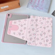 A hand holding a pink My Melody iPad case with cartoon character designs.