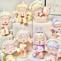 Collection of pastel-colored Pop Mart Skullpanda figurines on a white background