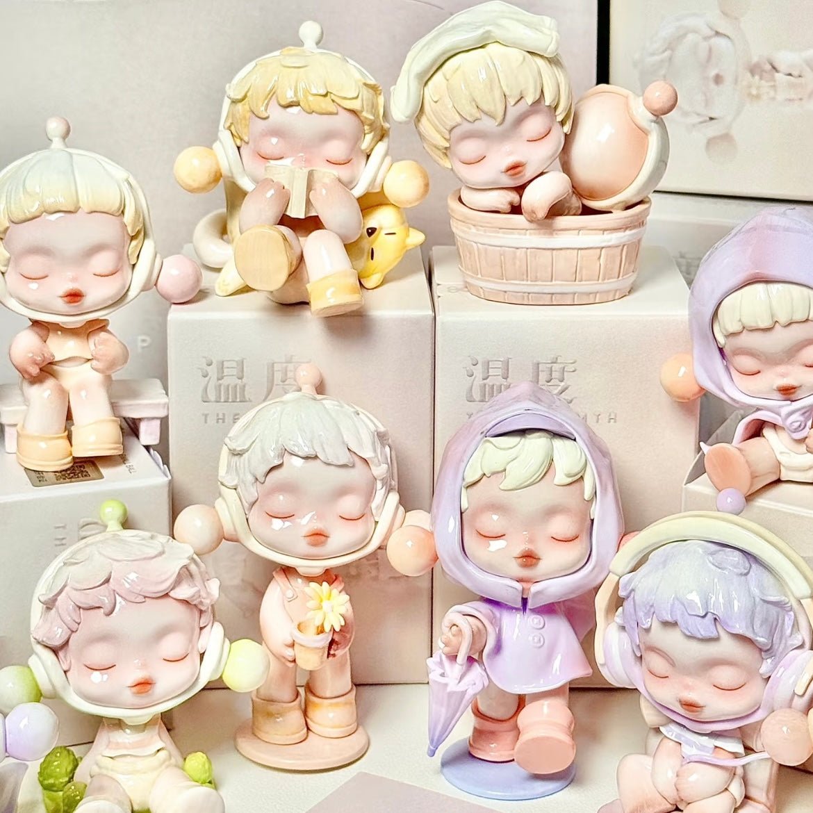 Collection of pastel-colored Pop Mart Skullpanda figurines on a white background