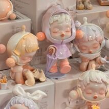 Collection of Pop Mart Skullpanda small figurines with a focus on a central figure holding an umbrella.