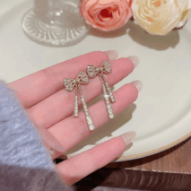 Trendy CZ Inlaid Bowknot Tassel Earrings - ArtGalleryZen